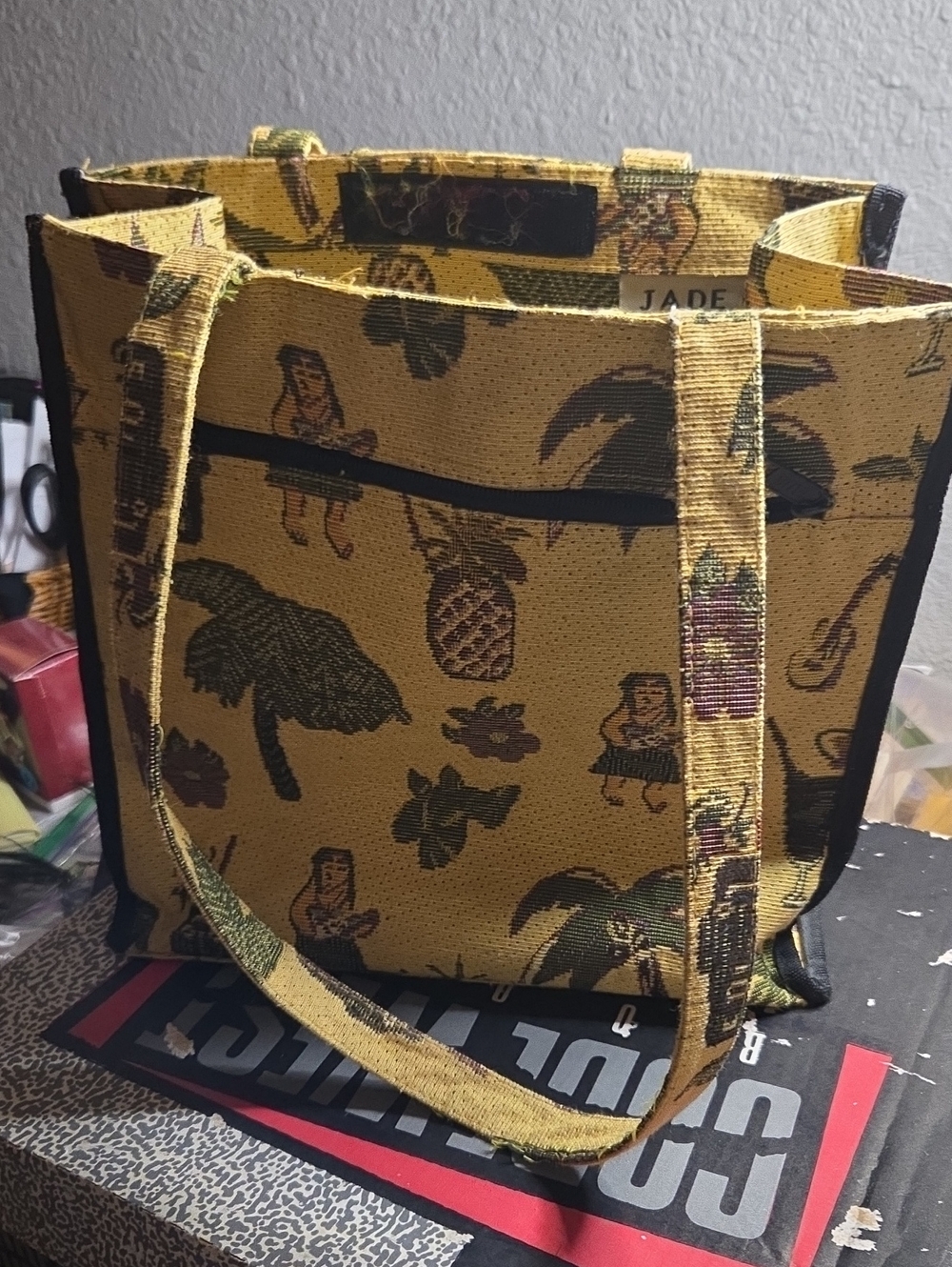 JADE brand tote bag is made from a yellow Hawaiian-themed tapestry material